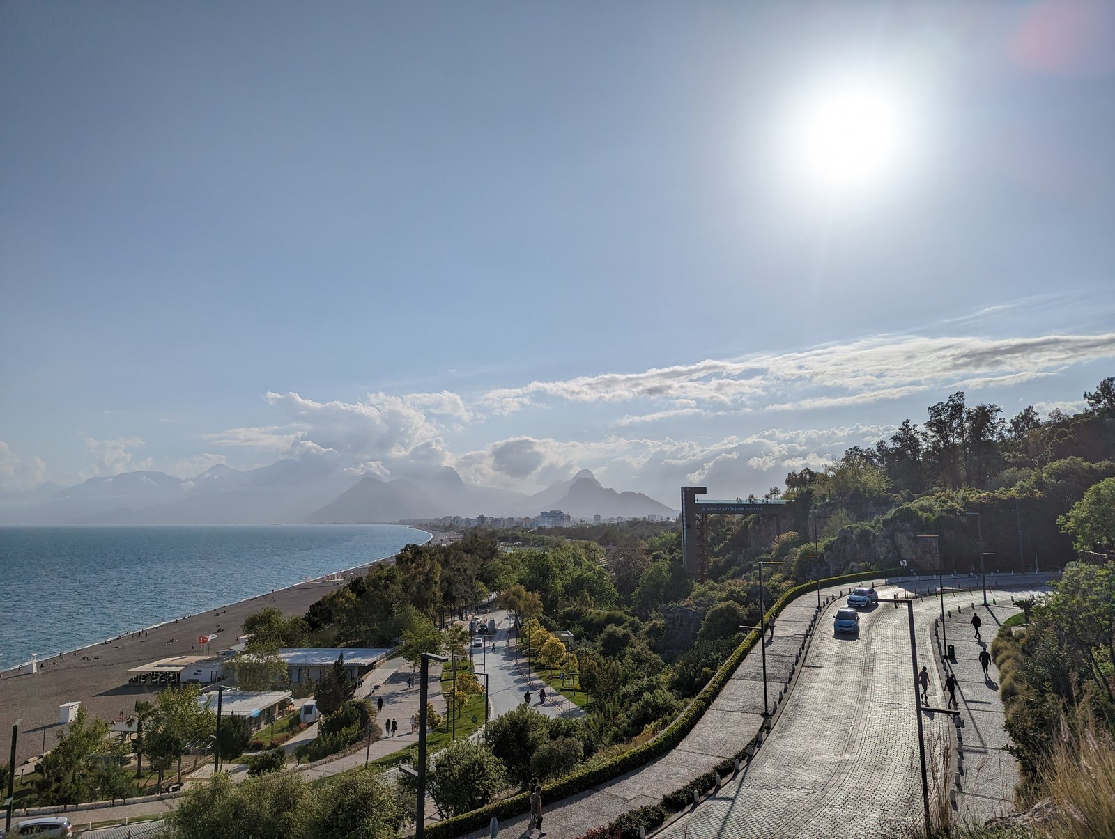 Konyaaltı Beach and its promenade beneath the Beydağları mountains in Antalya