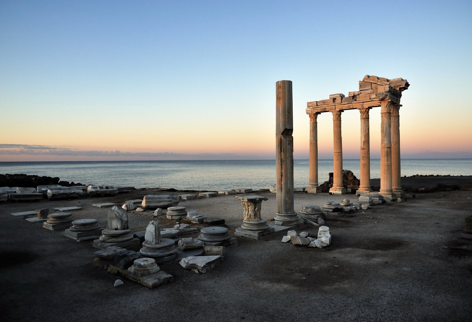 Columns and ruins of the Temple of Apollo beside the sea in Side at dawn